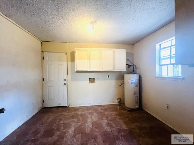 4407 Alejandro St, Mission, TX 78573 - washroom featuring cabinet space, water heater, electric dryer hookup, and a textured ceiling