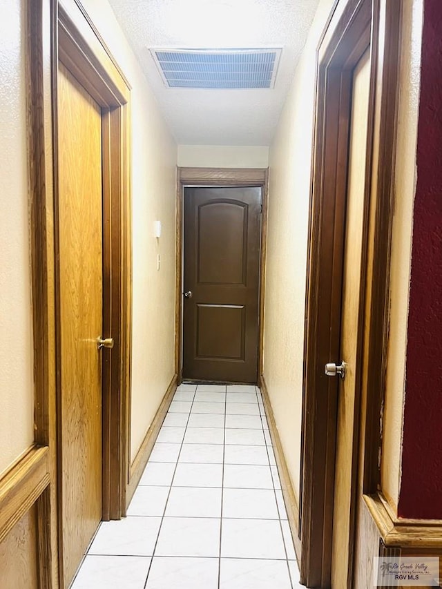 4407 Alejandro St, Mission, TX 78573 - corridor featuring light tile patterned floors and baseboards