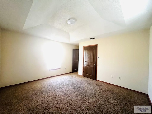 4407 Alejandro St, Mission, TX 78573 - empty room with carpet floors, baseboards, and vaulted ceiling