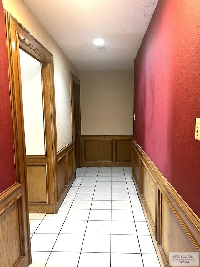 4407 Alejandro St, Mission, TX 78573 - hall featuring a wainscoted wall and light tile patterned flooring