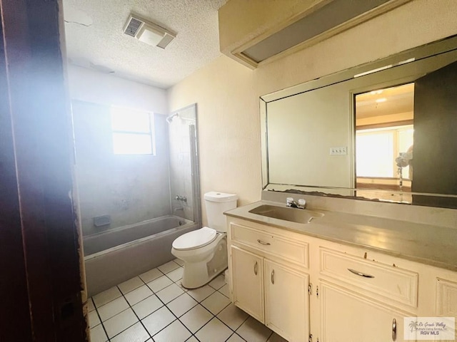 4407 Alejandro St, Mission, TX 78573 - bathroom with tile patterned flooring, toilet, a textured ceiling, washtub / shower combination, and vanity