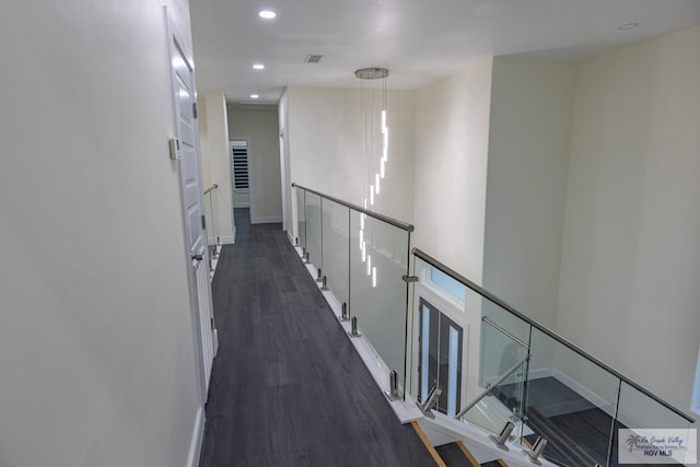 corridor with dark wood-type flooring