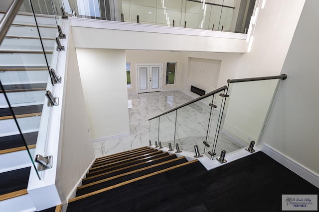 stairs featuring french doors