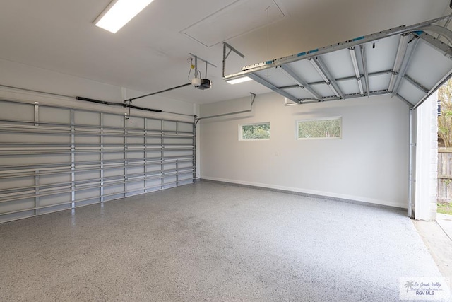 garage featuring a garage door opener