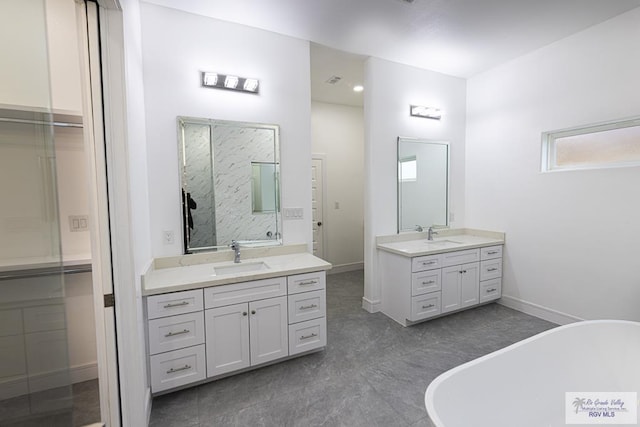 bathroom featuring vanity and a bathtub