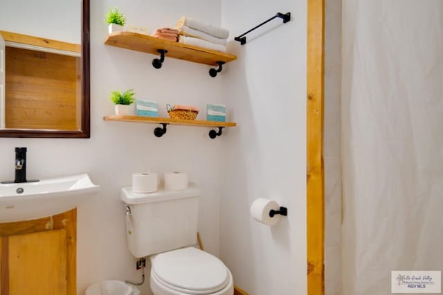 bathroom with sink and toilet