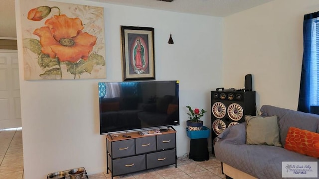 living area featuring light tile patterned floors