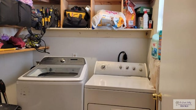 washroom featuring laundry area and independent washer and dryer