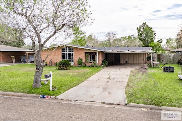 ranch-style house with a carport and a front yard