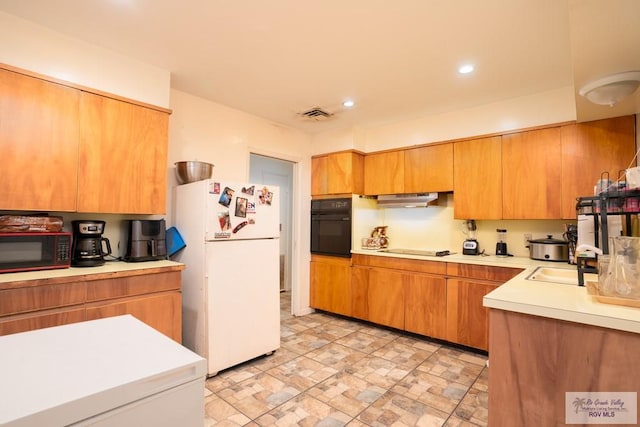 kitchen featuring sink and black appliances