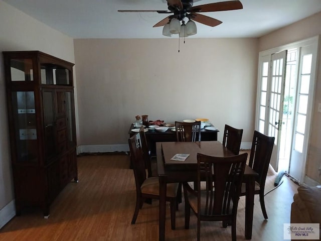 609 E Filmore Ave, Harlingen, TX 78550 - dining room featuring a ceiling fan and wood finished floors