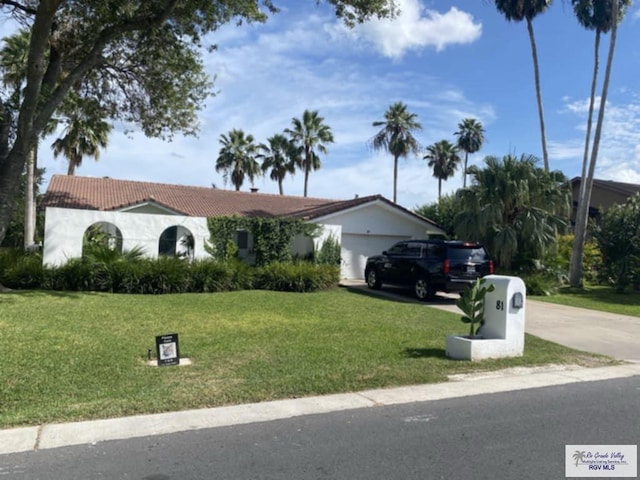 ranch-style house with a front lawn