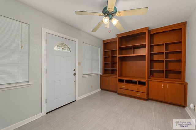 entrance foyer featuring ceiling fan