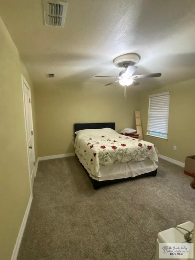 carpeted bedroom featuring ceiling fan