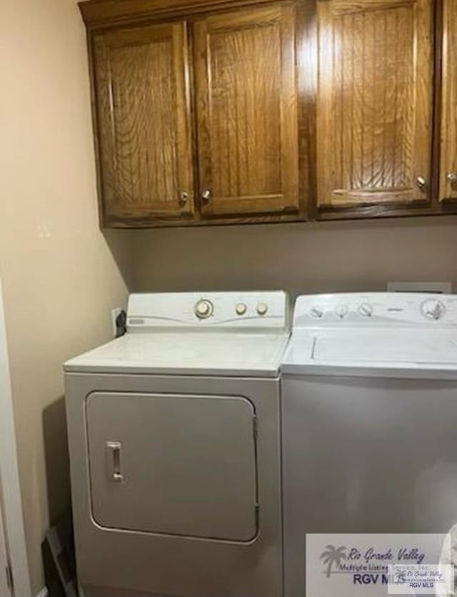 710 5th St Unit 5, Harlingen, TX 78550 - laundry area featuring cabinet space and washing machine and clothes dryer