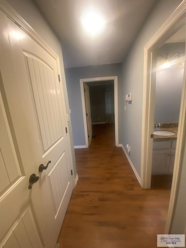 710 5th St Unit 5, Harlingen, TX 78550 - hall with wood finished floors and baseboards