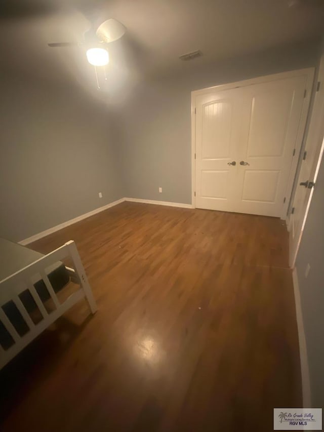710 5th St Unit 5, Harlingen, TX 78550 - unfurnished bedroom featuring wood finished floors and a closet