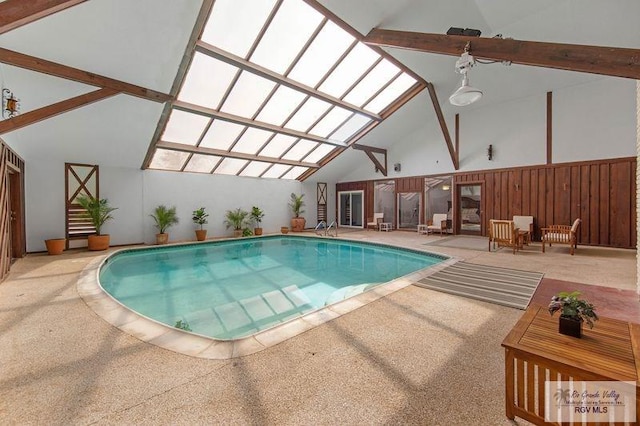 view of pool with a lanai and a patio area