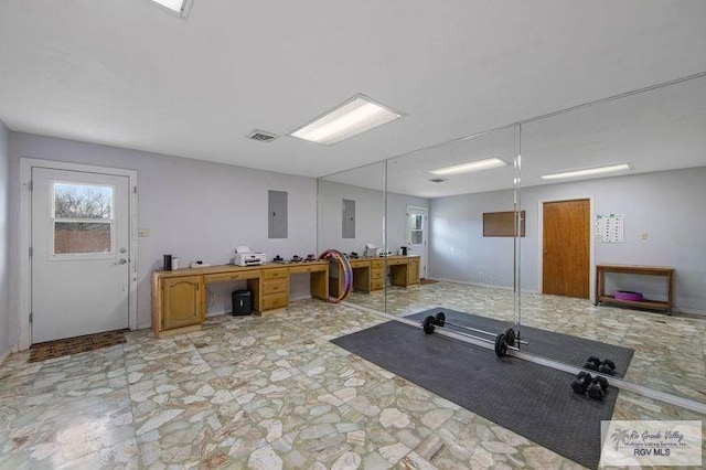 workout room featuring electric panel