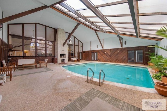 view of swimming pool featuring a skylight