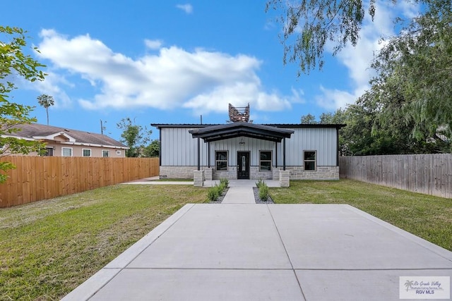 back of property featuring a lawn, a patio, and a porch