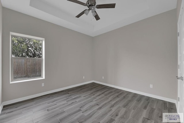 unfurnished room featuring ceiling fan and light hardwood / wood-style flooring