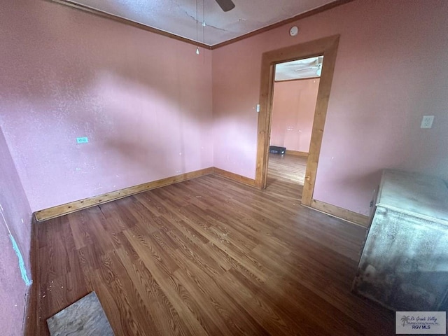 1022 E Monroe Ave, Harlingen, TX 78550 - spare room featuring wood finished floors, crown molding, a ceiling fan, and baseboards