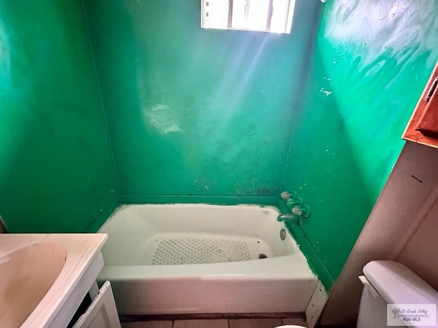 1022 E Monroe Ave, Harlingen, TX 78550 - full bathroom with toilet, tile patterned floors, a bath, and vanity