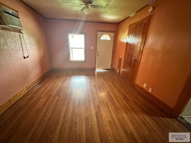 1022 E Monroe Ave, Harlingen, TX 78550 - entryway featuring wood finished floors, baseboards, a ceiling fan, a textured wall, and crown molding