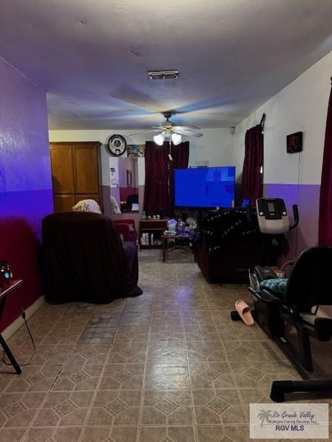 living room featuring ceiling fan