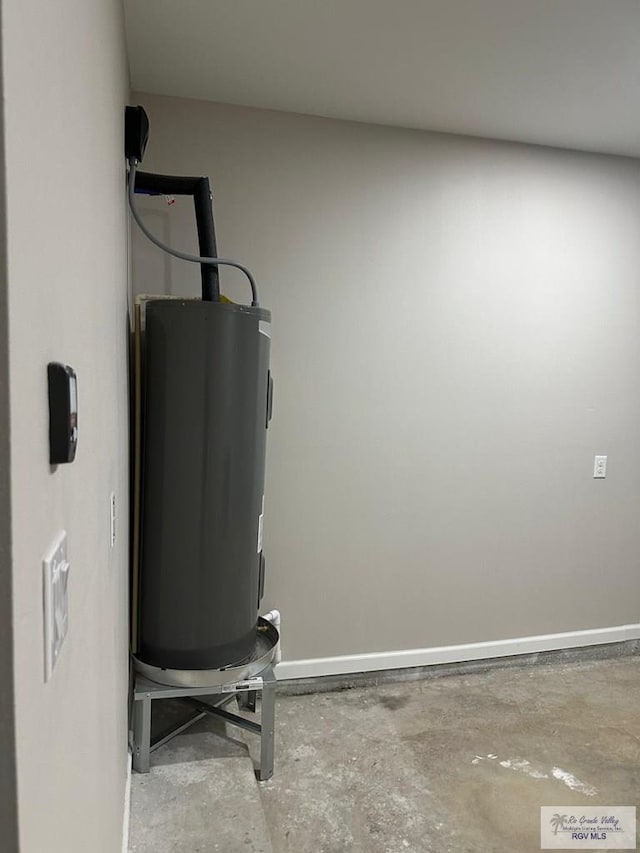 utility room with electric water heater