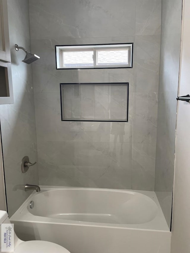 full bathroom featuring shower / bathing tub combination and toilet