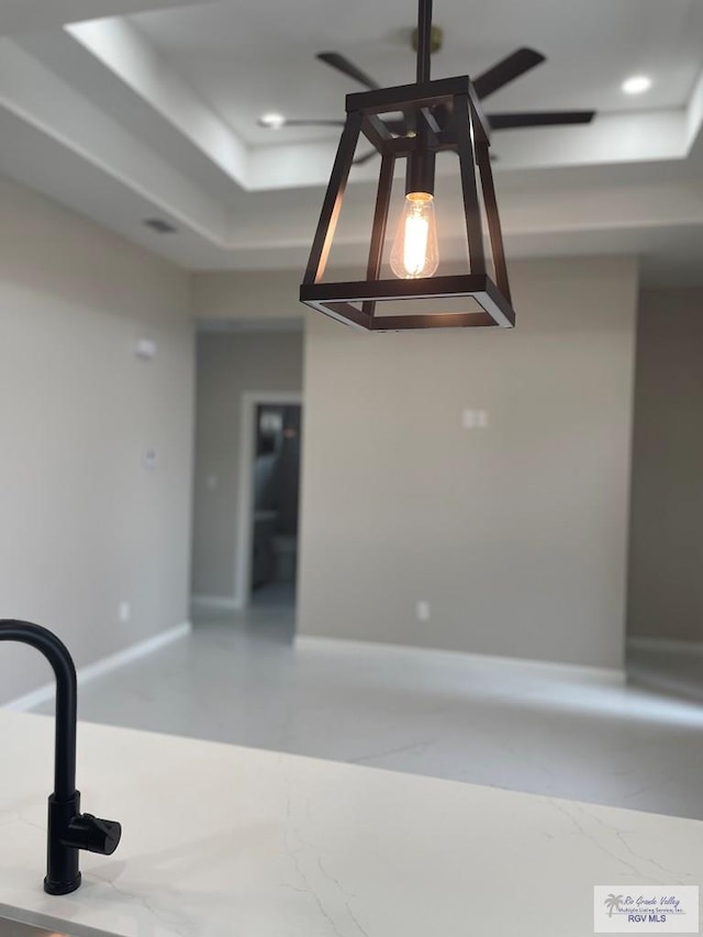 room details with a tray ceiling, baseboards, and recessed lighting