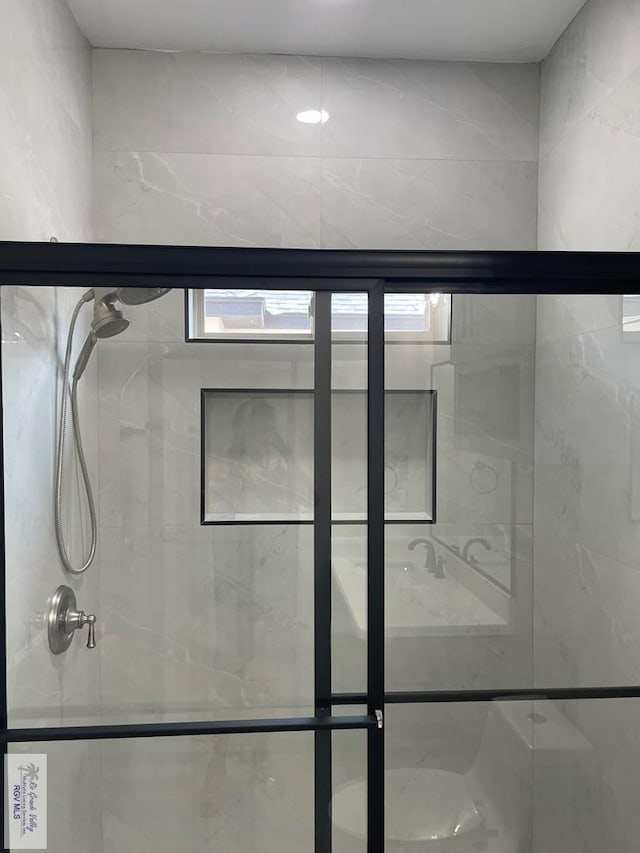 full bathroom featuring a shower stall