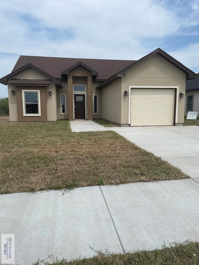 view of front of home featuring a garage, a shingled roof, concrete driveway, stucco siding, and a front lawn