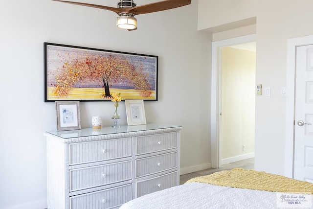 tiled bedroom with ceiling fan