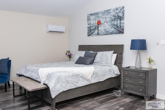 bedroom featuring dark hardwood / wood-style floors and an AC wall unit