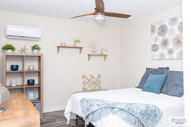 bedroom featuring dark hardwood / wood-style floors, a wall unit AC, and ceiling fan