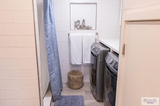 bathroom with washer and dryer