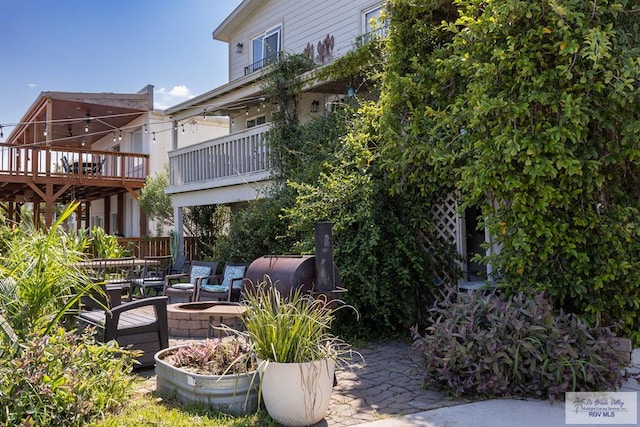 view of patio / terrace with an outdoor living space with a fire pit