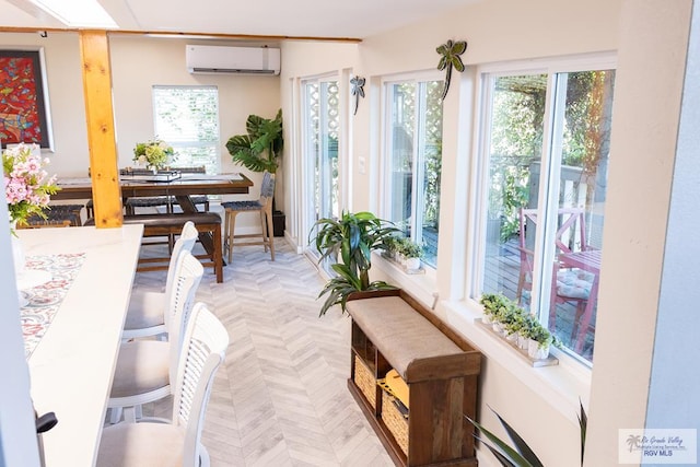 sunroom / solarium featuring a wall mounted AC