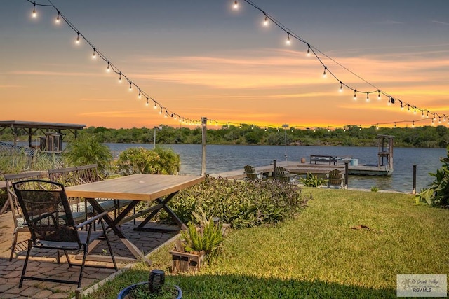 dock area featuring a yard and a water view