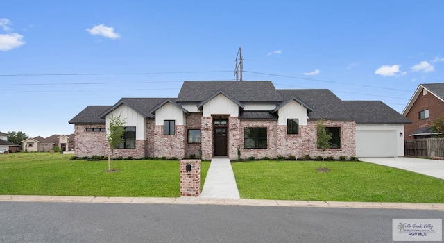 view of front of house with a front yard, a shingled roof, driveway, board and batten siding, and an attached garage