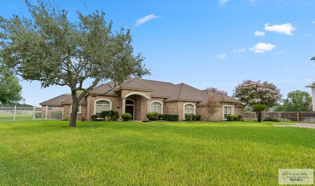 14823 S Valencia Cir, Harlingen, TX 78552 - view of front facade featuring brick siding