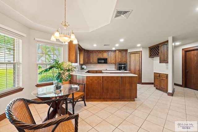 14823 S Valencia Cir, Harlingen, TX 78552 - kitchen with black microwave, stainless steel oven, a peninsula, tasteful backsplash, and recessed lighting