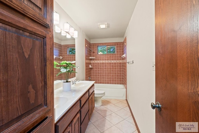 14823 S Valencia Cir, Harlingen, TX 78552 - bathroom featuring double vanity, tile patterned floors, and bathing tub / shower combination