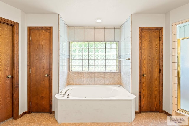 14823 S Valencia Cir, Harlingen, TX 78552 - full bathroom with a closet, tile patterned floors, a tub with jets, and a shower stall