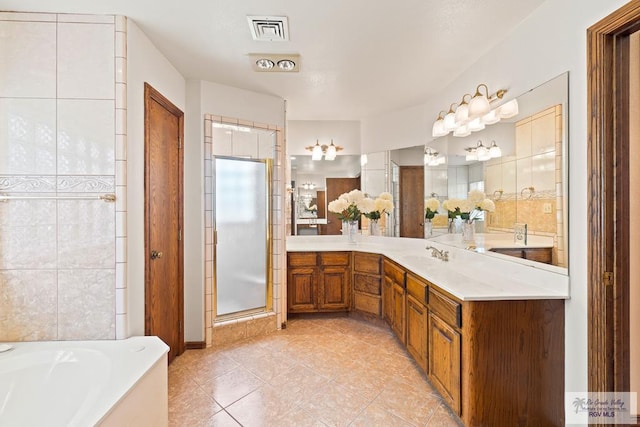 14823 S Valencia Cir, Harlingen, TX 78552 - full bath with vanity, tile patterned floors, a bath, and a shower stall
