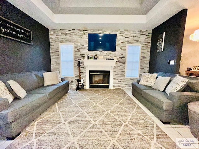 living room with a tray ceiling