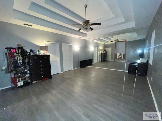 1822 Nasa, Brownsville, TX 78521 - unfurnished living room with a raised ceiling, a ceiling fan, and wood finished floors